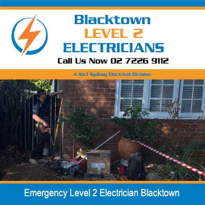 Emergency electrical work site at night with safety tape and equipment at residential property in Blacktown